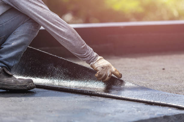 Professional Basement Waterproofing technician working in Covington, OH